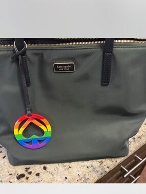 kate spade dark green tote with rainbow spade charm